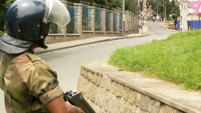 a-riot-police-officer-stands-guard-during-a-demonstration-by-opposition-supporters-in-antananarivo_5998504.jpg